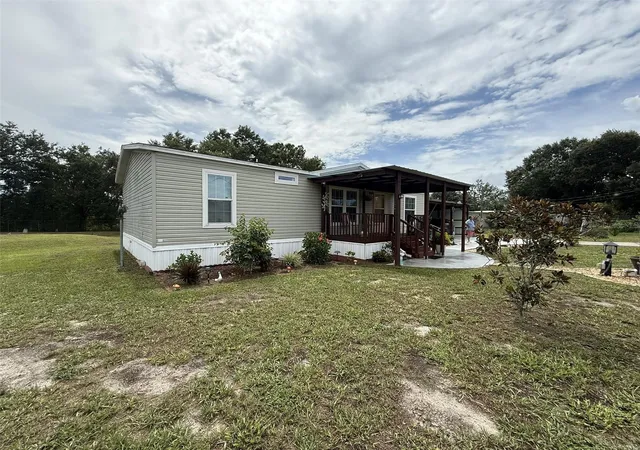 Photo 2 of Manufactured home for sale at 9049 Burr Dr, Polk City, FL 33868 | MLS# S5157988 | Listing updated on 2026-09-28