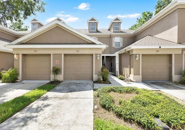 Photo 1 of Townhouse for sale at 9811 Fan Palm Way, Tampa, FL 33610 | MLS# O6443539 | Listing updated on 2026-09-21
