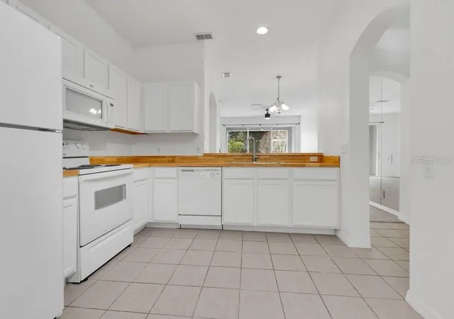 Photo 3 of Townhouse for sale at 9811 Fan Palm Way, Tampa, FL 33610 | MLS# O6443539 | Listing updated on 2026-09-21