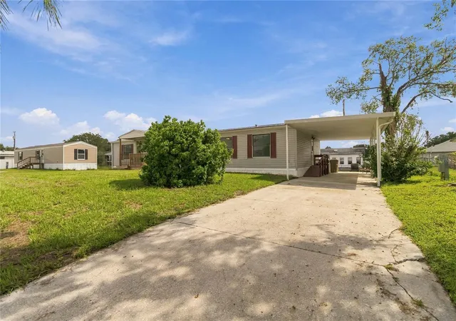 Photo 2 of Manufactured home for sale at 417 Lagoon Ct, Kenansville, FL 34739 | MLS# S5158024 | Listing updated on 2026-09-24
