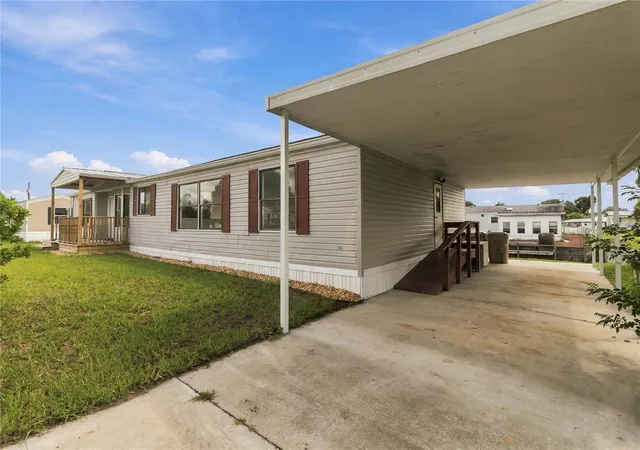 Photo 3 of Manufactured home for sale at 417 Lagoon Ct, Kenansville, FL 34739 | MLS# S5158024 | Listing updated on 2026-09-24