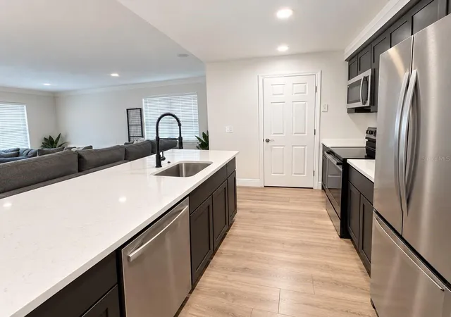 Photo 3 of Condo for sale at 6611 Time Sq Ave #105, Orlando, FL 32835 | MLS# O6443757 | Listing updated on 2026-10-05