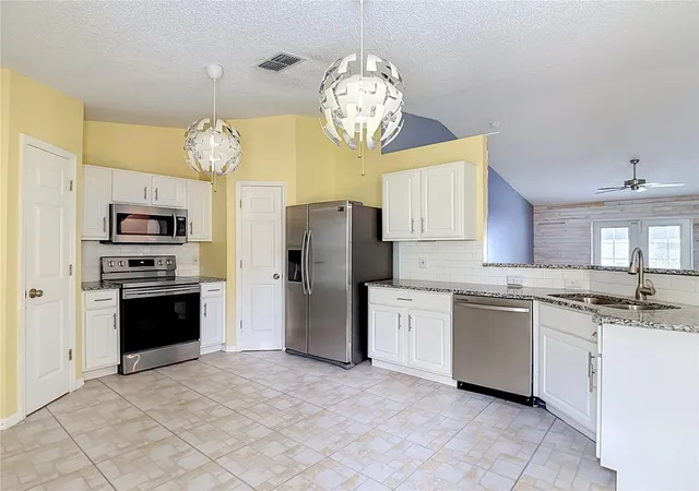 Photo 4 of Single family home for sale at 12730 Kings Lake Dr, Gibsonton, FL 33534 | MLS# TB8551216 | Listing updated on 2026-09-25