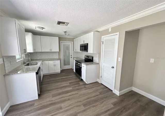 Photo 3 of Single family home for sale at 322 Reading St Nw, Port Charlotte, FL 33952 | MLS# C7531095 | Listing updated on 2026-10-20
