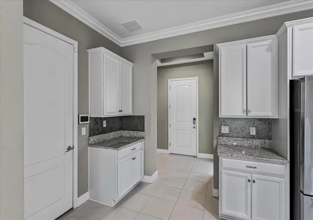 Photo 3 of Single family home for sale at 14121 Alafaya Oak Bnd, Orlando, FL 32828 | MLS# O6444283 | Listing updated on 2026-10-08