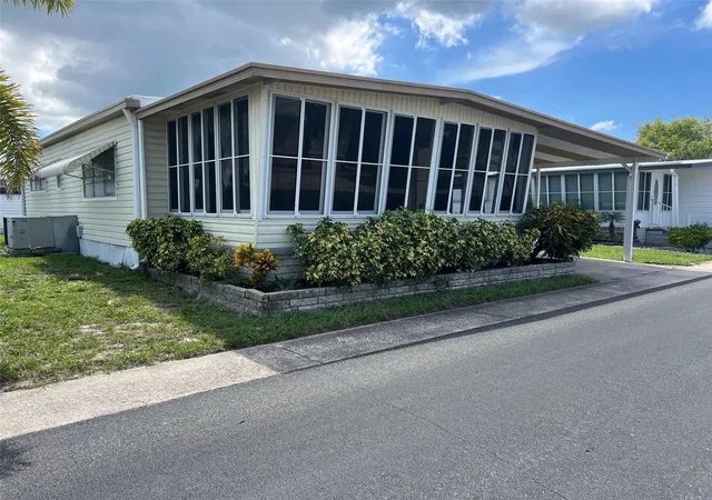 Photo 3 of Manufactured home for sale at 19 Pindo Palm St W, Largo, FL 33770 | MLS# TB8551699 | Listing updated on 2026-09-24