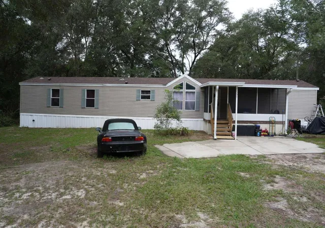 Photo 1 of Manufactured home for sale at 12330 NE 77th Court, Bronson, FL 32621 | MLS# OM732812 | Listing updated on 2026-10-05