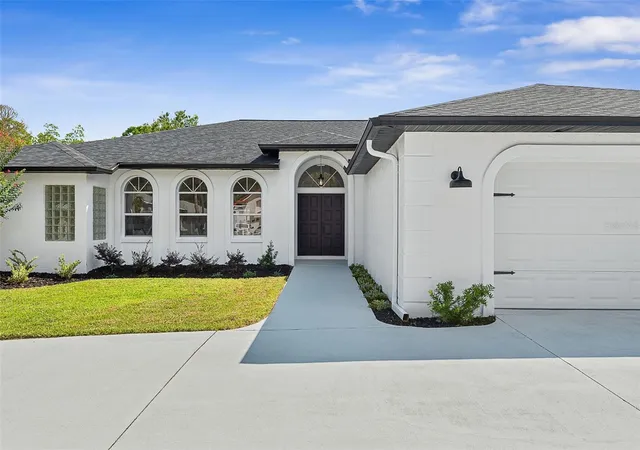 Photo 3 of Single family home for sale at 34 Woodhollow Ln, Palm Coast, FL 32164 | MLS# FC321672 | Listing updated on 2026-09-24