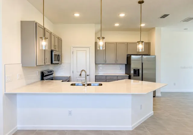 Photo 2 of Townhouse for sale at 10592 Ebb Tide Ln, Orlando, FL 32821 | MLS# O6444567 | Listing updated on 2026-10-08
