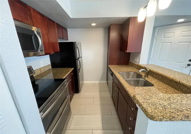 Photo 2 of Condo for sale at 5128 Conroy Rd #13, Orlando, FL 32811 | MLS# O6444648 | Listing updated on 2026-09-25