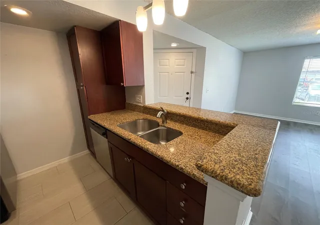 Photo 3 of Condo for sale at 5128 Conroy Rd #13, Orlando, FL 32811 | MLS# O6444648 | Listing updated on 2026-09-25