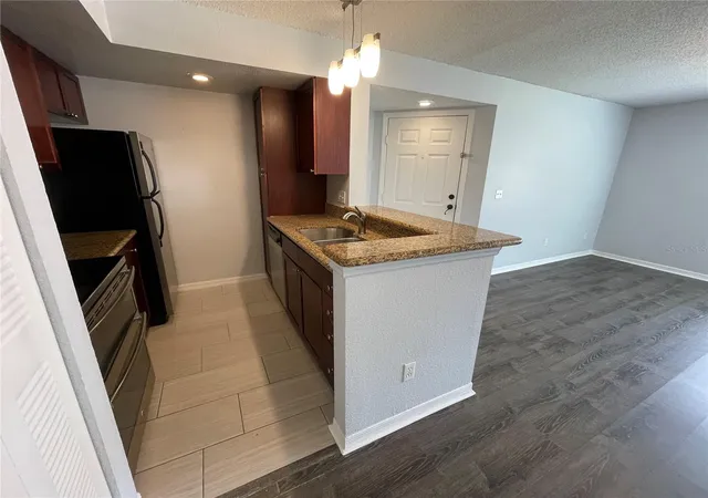 Photo 4 of Condo for sale at 5128 Conroy Rd #13, Orlando, FL 32811 | MLS# O6444648 | Listing updated on 2026-09-25
