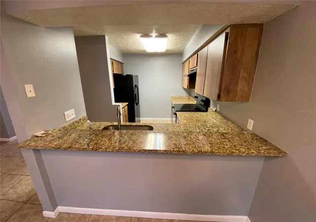 Photo 4 of Townhouse for sale at 9459 Forest Hills Cir, Tampa, FL 33612 | MLS# TB8552016 | Listing updated on 2026-10-04