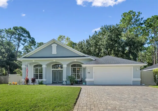 Photo 1 of Single family home for sale at 54 Woodworth Dr, Palm Coast, FL 32164 | MLS# FC321692 | Listing updated on 2026-09-26