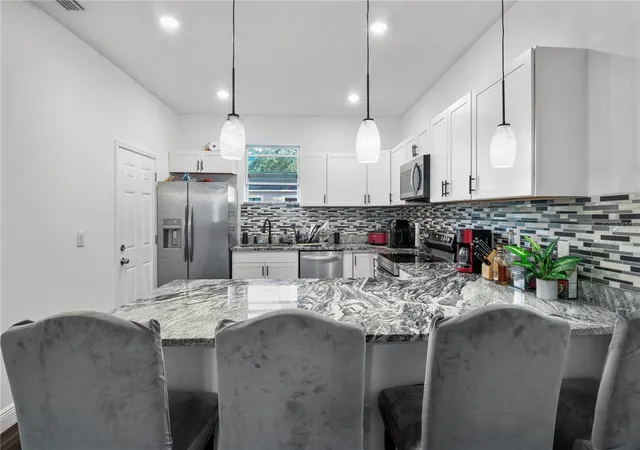 Photo 4 of Single family home for sale at 4411 N Troy St, Tampa, FL 33610 | MLS# TB8552031 | Listing updated on 2026-09-25