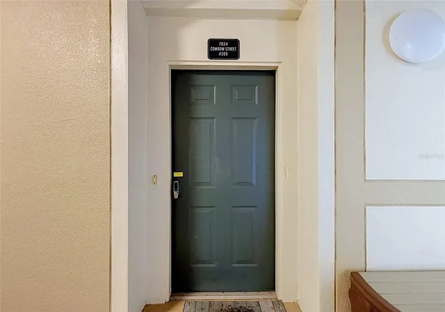 Listing Photo 1 - Condo for sale in building located at 7654 Comrow St, Kissimmee, FL 34747 - Unit #205