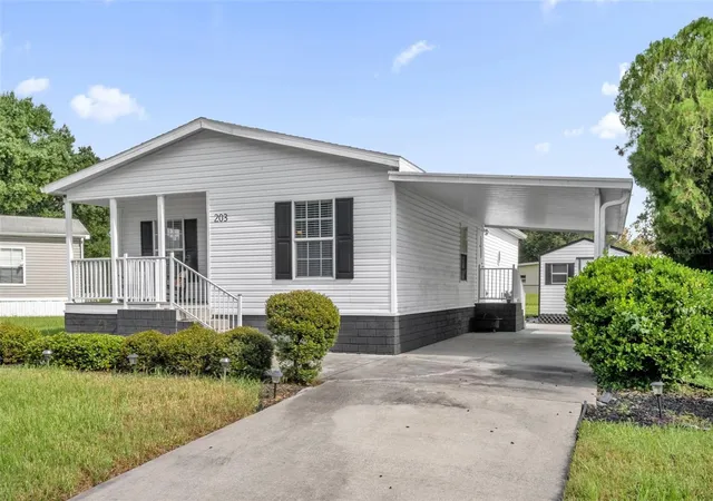 Photo 2 of Manufactured home for sale at 203 Ellsworth Dr, Kissimmee, FL 34758 | MLS# S5158375 | Listing updated on 2026-10-08