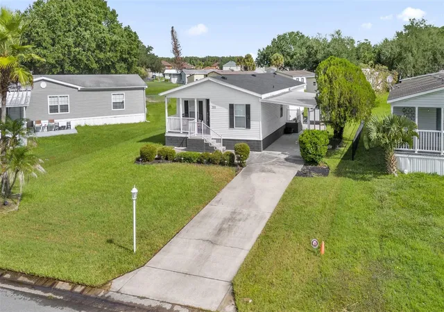 Photo 3 of Manufactured home for sale at 203 Ellsworth Dr, Kissimmee, FL 34758 | MLS# S5158375 | Listing updated on 2026-10-08