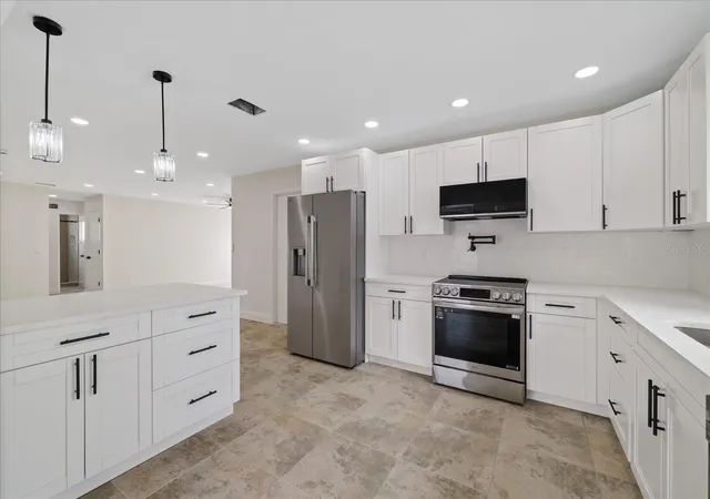 Photo 3 of Single family home for sale at 1016 Fuchsia Dr, Holiday, FL 34691 | MLS# TB8552589 | Listing updated on 2026-10-05