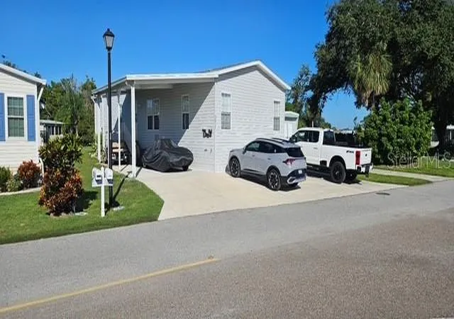 Photo 1 of Manufactured home for sale at 5652 Holiday Park Blvd, North Port, FL 34287 | MLS# C7531267 | Listing updated on 2026-10-11