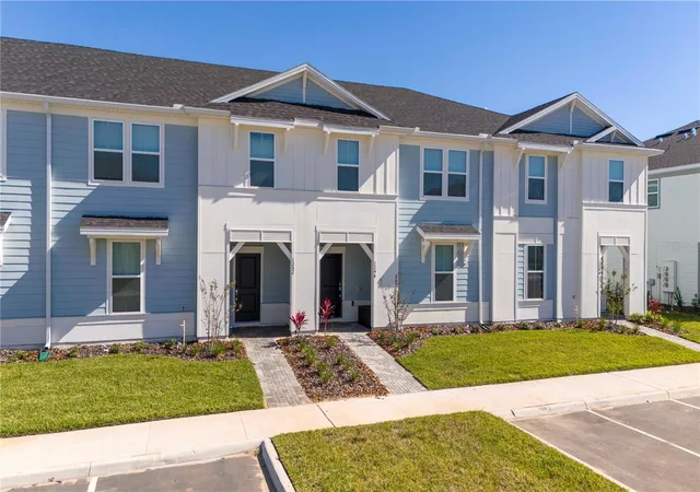 Photo 1 of Townhouse for sale at 1248 Blue Is Dr, Clermont, FL 34714 | MLS# O6445212 | Listing updated on 2026-10-21
