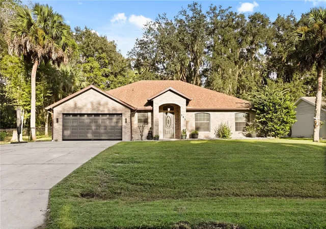 Photo 1 of Single family home for sale at 141 Poinciana Ln, Deltona, FL 32738 | MLS# O6445401 | Listing updated on 2026-09-30