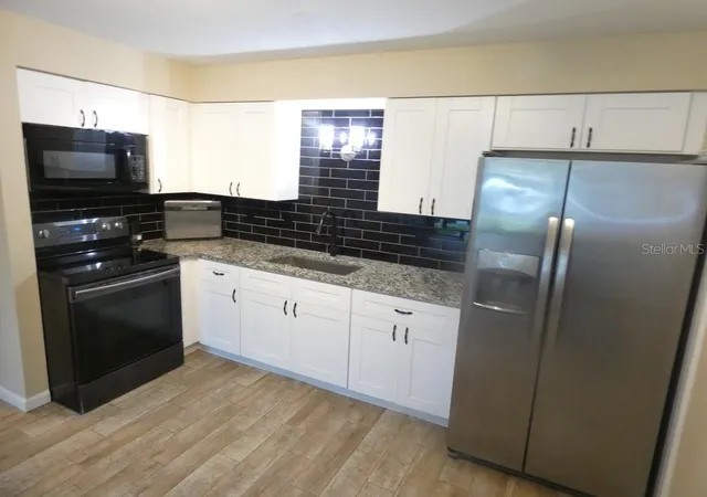 Photo 3 of Condo for sale at 4322 Tahitian Gdns Cir #B, Holiday, FL 34691 | MLS# W7889896 | Listing updated on 2026-09-30