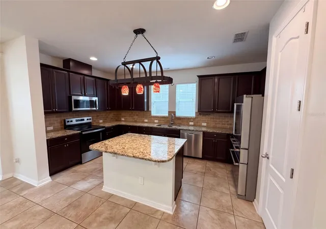 Photo 4 of Single family home for sale at 8231 Laureate Blvd, Orlando, FL 32827 | MLS# O6445629 | Listing updated on 2026-10-08