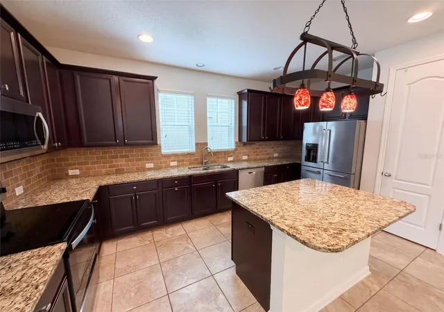 Photo 3 of Single family home for sale at 8231 Laureate Blvd, Orlando, FL 32827 | MLS# O6445629 | Listing updated on 2026-10-08
