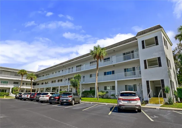 Listing Photo 1 - Condo for sale in building located at 2001 World Pkwy Blvd, CLEARWATER, FL 33763 - Unit #59