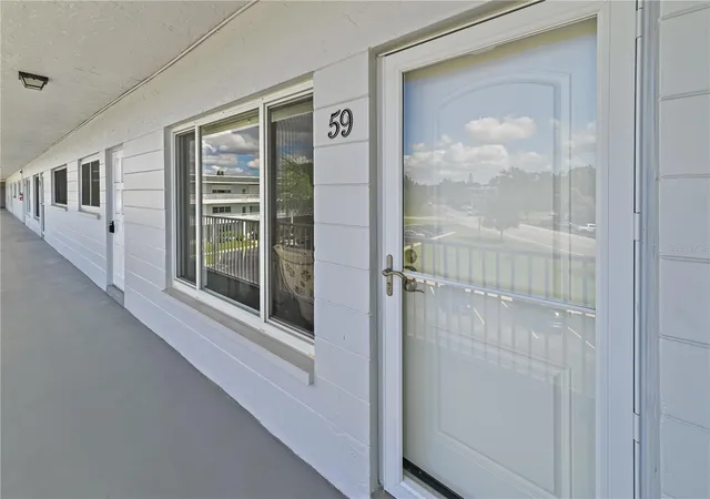 Listing Photo 3 - Condo for sale in building located at 2001 World Pkwy Blvd, CLEARWATER, FL 33763 - Unit #59