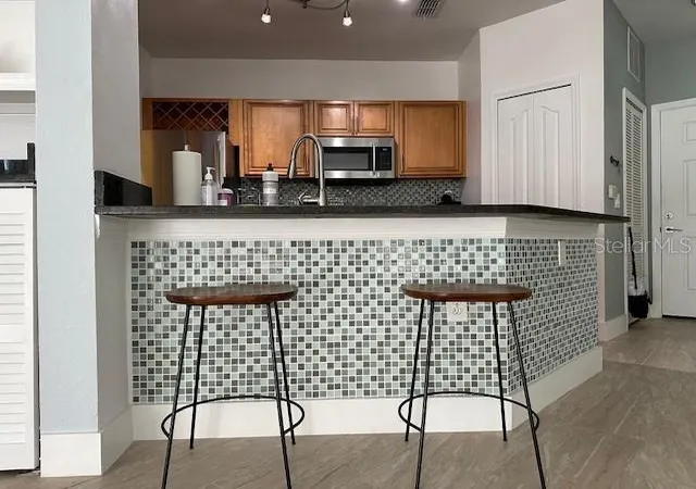 Photo 3 of Condo for sale at 6159 Metrowest Blvd #108, Orlando, FL 32835 | MLS# O6446034 | Listing updated on 2026-09-30