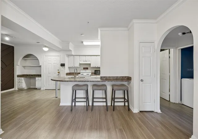 Photo 1 of Condo for sale at 911 N Orange Ave #411, Orlando, FL 32801 | MLS# O6446054 | Listing updated on 2026-10-07