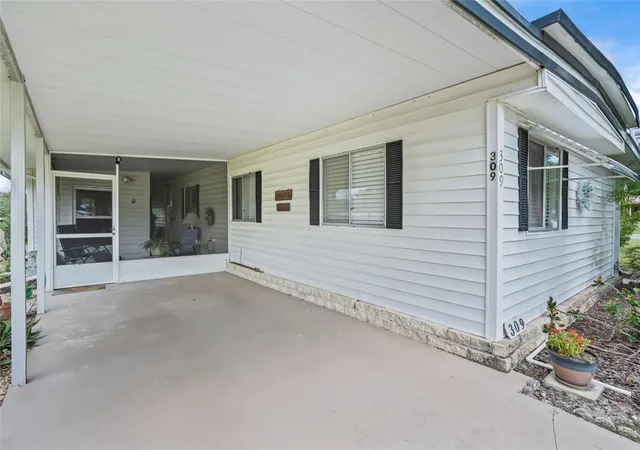 Photo 1 of Manufactured home for sale at 309 Sheerwood Dr, Lady Lake, FL 32159 | MLS# OM733143 | Listing updated on 2026-09-30