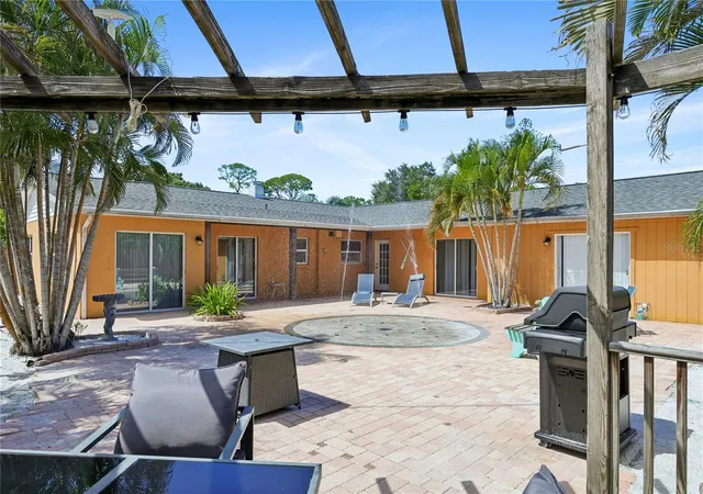 Photo 2 of Single family home for sale at 8479 Pinewood Rd, Sarasota, FL 34243 | MLS# A4707949 | Listing updated on 2026-10-01
