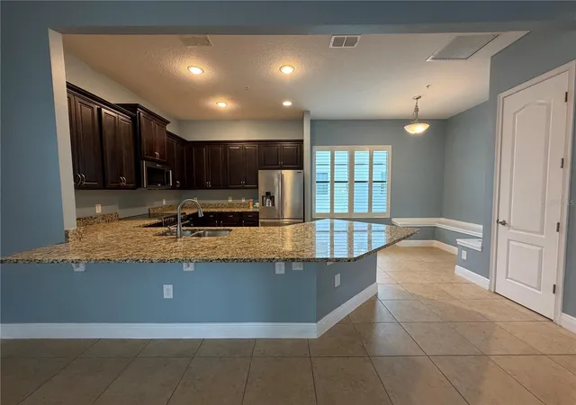 Photo 4 of Townhouse for sale at 12952 Brandon Coates Dr, Orlando, FL 32828 | MLS# O6446153 | Listing updated on 2026-10-01