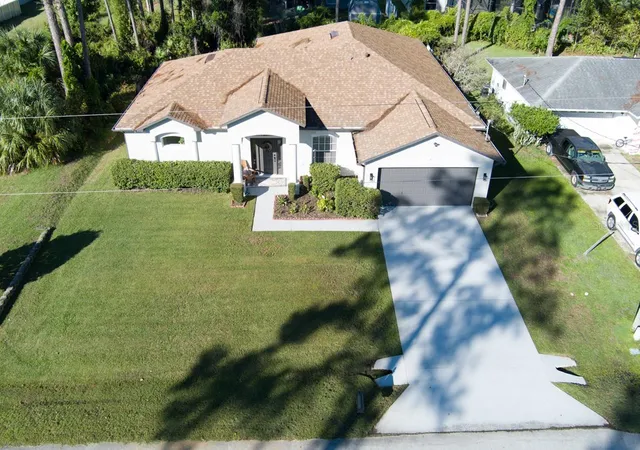 Photo 2 of Single family home for sale at 37 Woodlyn Ln, Palm Coast, FL 32164 | MLS# FC321817 | Listing updated on 2026-10-17