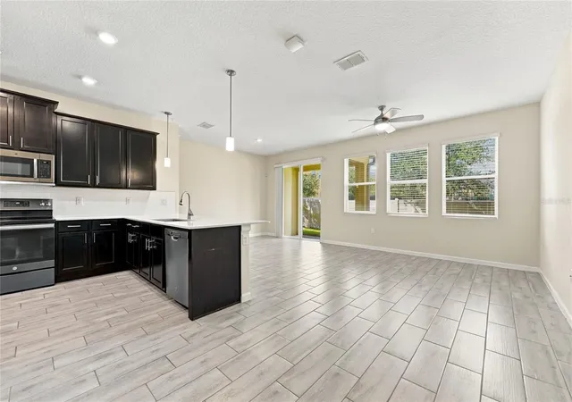 Photo 2 of Townhouse for sale at 302 Muscogee Ln, Orlando, FL 32825 | MLS# O6446377 | Listing updated on 2026-10-27