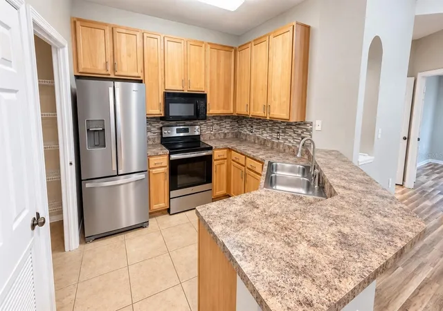 Listing Photo 4 - Condo for sale in building located at 10209 Courtney Palms Blvd, Tampa, FL 33619 - Unit #301