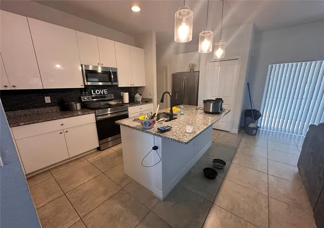 Photo 4 of Single family home for sale at 40 Orchid Ln, Kissimmee, FL 34759 | MLS# A4708117 | Listing updated on 2026-10-17