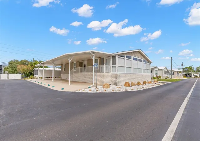 Photo 1 of Manufactured home for sale at 7300 Americana Dr Ne #143, Saint Petersburg, FL 33702 | MLS# TB8553983 | Listing updated on 2026-10-02