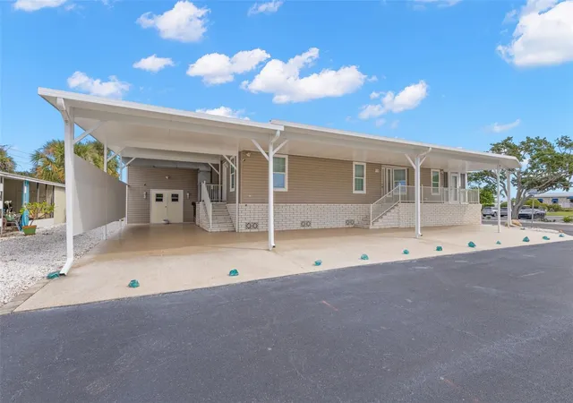 Photo 2 of Manufactured home for sale at 7300 Americana Dr Ne #143, Saint Petersburg, FL 33702 | MLS# TB8553983 | Listing updated on 2026-10-02