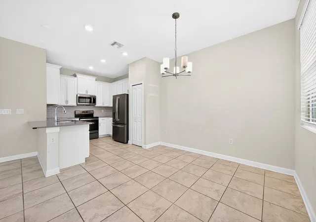 Photo 4 of Townhouse for sale at 4911 Tribute Trl, Kissimmee, FL 34746 | MLS# O6446579 | Listing updated on 2026-10-08