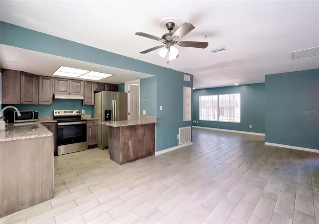 Photo 3 of Condo for sale at 5423 Brookswood Way #801, Orlando, FL 32808 | MLS# O6446598 | Listing updated on 2026-10-06