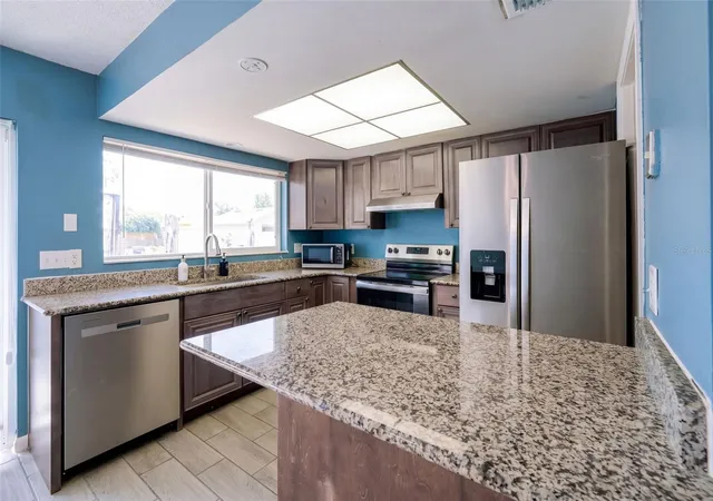 Photo 4 of Condo for sale at 5423 Brookswood Way #801, Orlando, FL 32808 | MLS# O6446598 | Listing updated on 2026-10-06