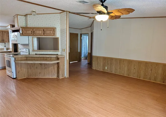 Photo 3 of Manufactured home for sale at 12180 NE 238th Terrace, Fort Mc Coy, FL 32134 | MLS# OM733311 | Listing updated on 2026-10-08