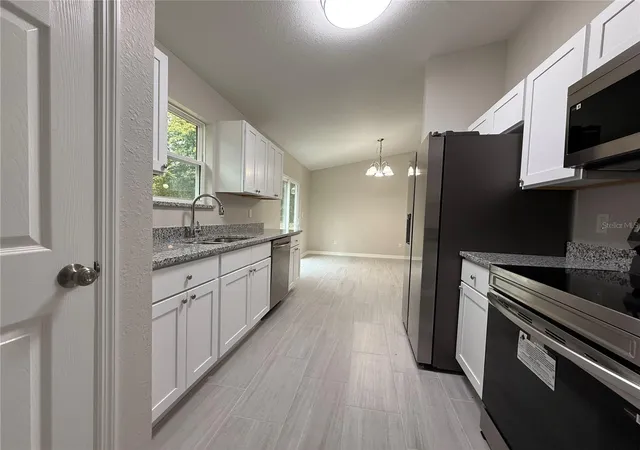 Photo 3 of Single family home for sale at 1323 NW 52nd Court, Ocala, FL 34482 | MLS# OM733342 | Listing updated on 2026-10-04