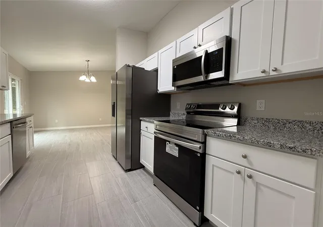Photo 4 of Single family home for sale at 1323 NW 52nd Court, Ocala, FL 34482 | MLS# OM733342 | Listing updated on 2026-10-04