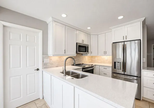 Photo 3 of House for sale at 913 Sutton Pl, Palm Harbor, FL 34684 | MLS# TB8554386 | Listing updated on 2026-10-05