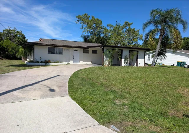 Photo 1 of Single family home for sale at 21358 Burkhart Dr, Port Charlotte, FL 33952 | MLS# O6446796 | Listing updated on 2026-10-06